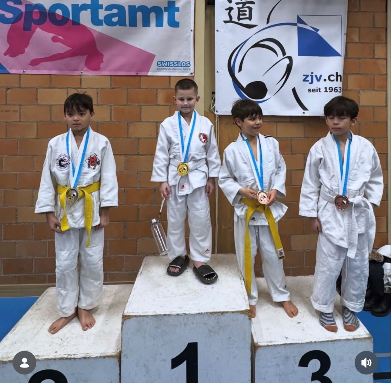 Izzy Cheli'oss on top of the judo podium
